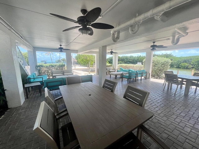 view of patio / terrace with an outdoor living space and ceiling fan