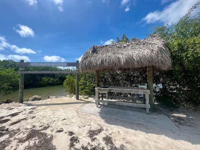 view of community with a gazebo and a water view