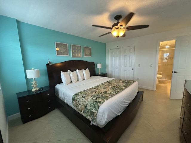 bedroom with ceiling fan, a closet, and light tile patterned floors