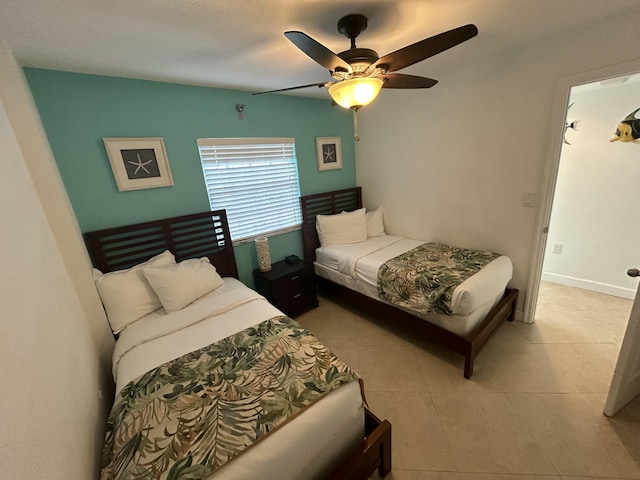 bedroom with light tile patterned flooring and ceiling fan