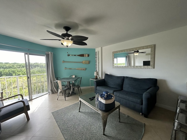 living room with light tile patterned floors and ceiling fan