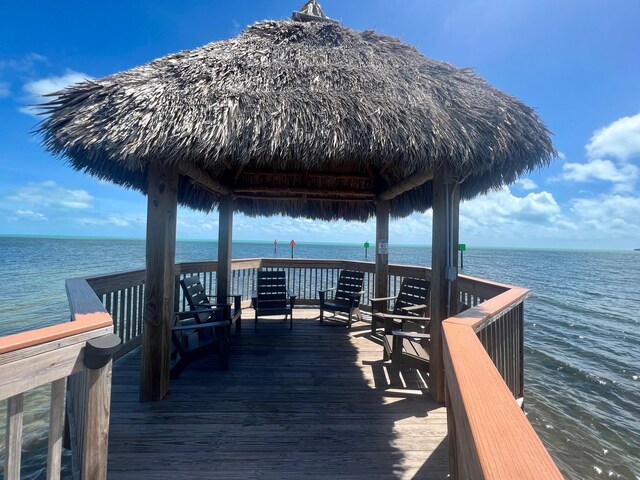 dock area with a gazebo and a water view