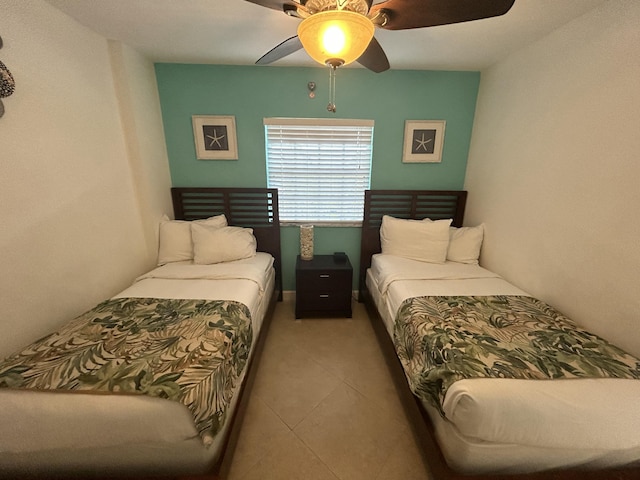 tiled bedroom with ceiling fan