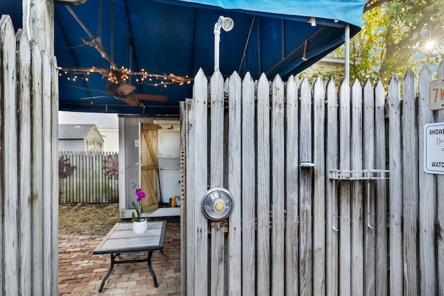 view of gate with fence