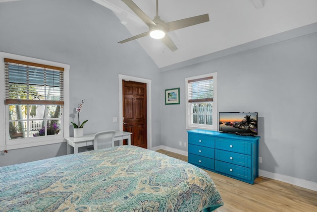 bedroom with lofted ceiling, ceiling fan, light wood-type flooring, and baseboards