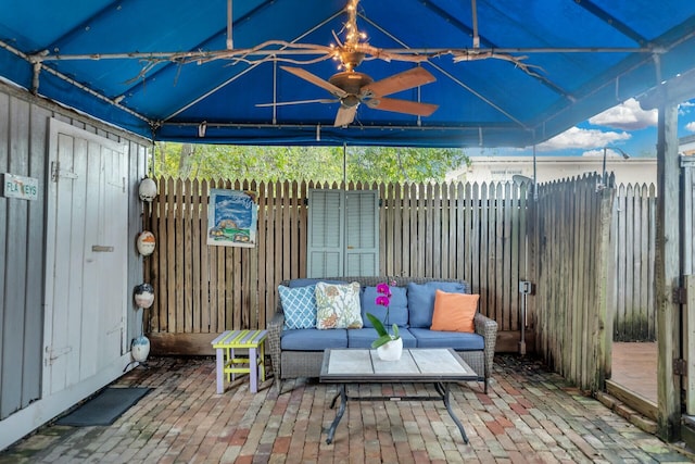 view of patio with outdoor lounge area and fence