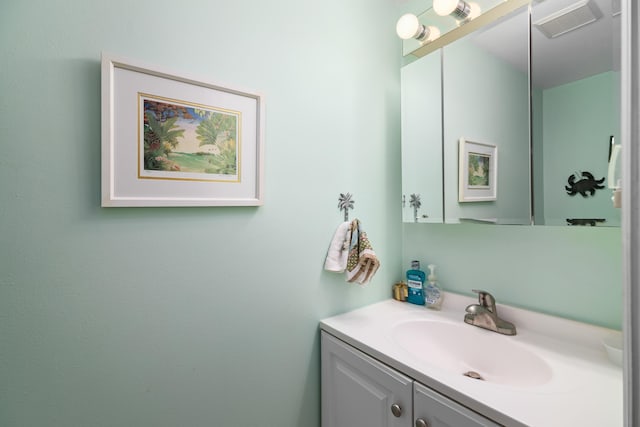 bathroom featuring visible vents and vanity