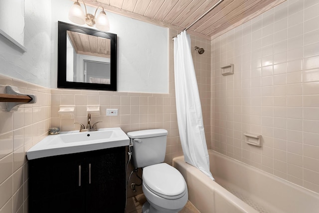 full bathroom with vanity, tile walls, shower / bathtub combination with curtain, and toilet