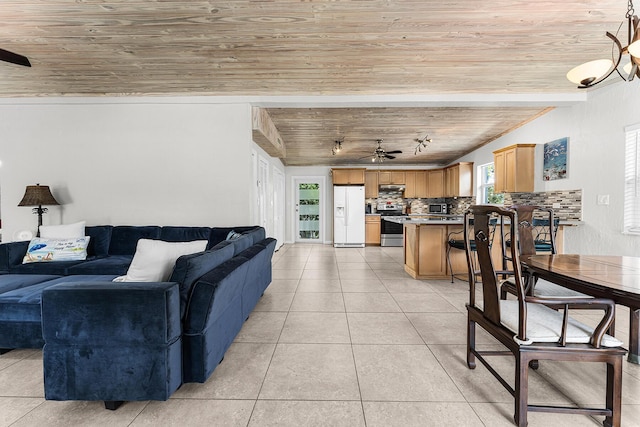 living room featuring ceiling fan, light tile patterned floors, and wood ceiling