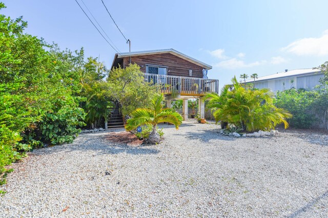 view of front of home with a carport