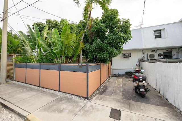 view of property exterior with fence