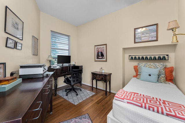 bedroom with dark wood-type flooring