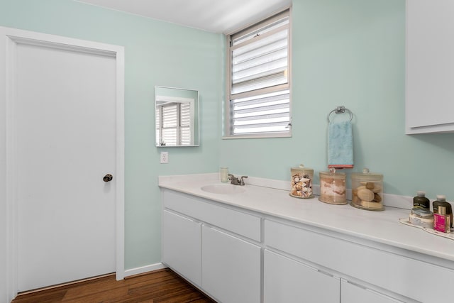 bathroom with hardwood / wood-style flooring and vanity