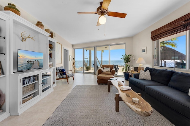 living room with light tile patterned flooring, built in features, and ceiling fan