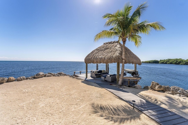 dock area with a gazebo and a water view