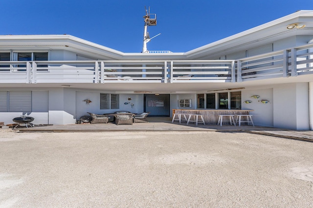 exterior space featuring exterior bar and a patio area