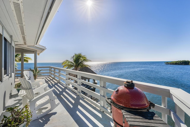 balcony featuring a water view