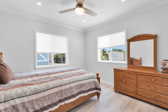 bedroom featuring multiple windows, ornamental molding, light wood-style floors, recessed lighting, and baseboards