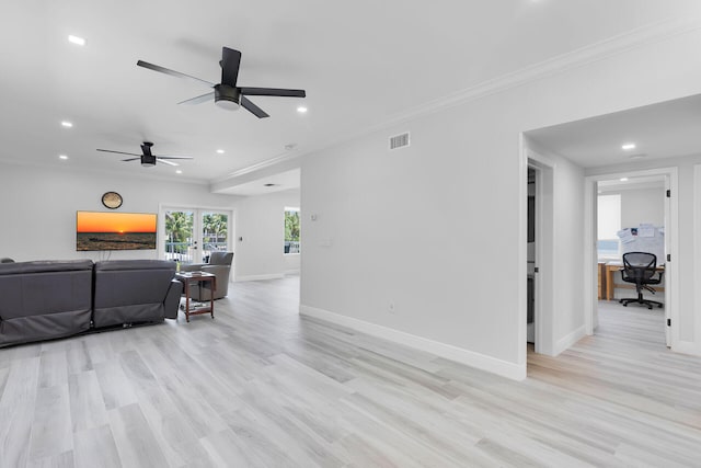 living room featuring baseboards, recessed lighting, ornamental molding, light wood finished floors, and a ceiling fan