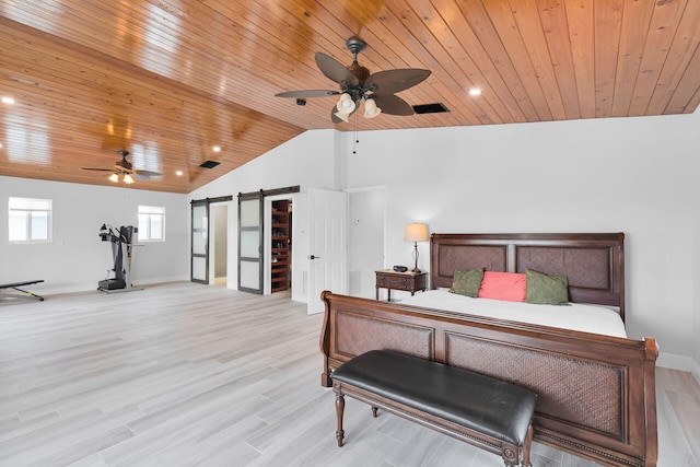 bedroom featuring a barn door, wood ceiling, vaulted ceiling, baseboards, and light wood-style flooring