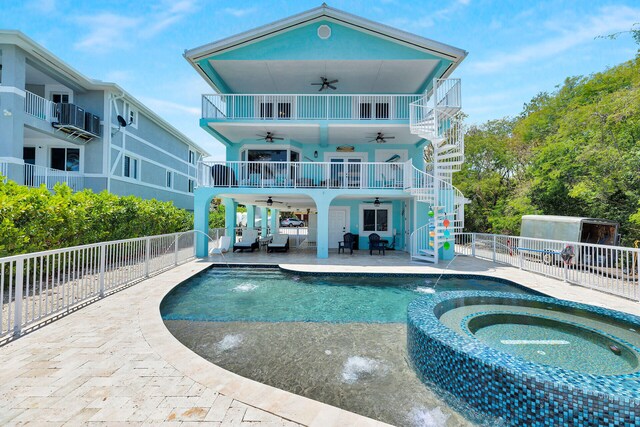 back of house featuring ceiling fan, a fenced backyard, stairs, and an outdoor hangout area