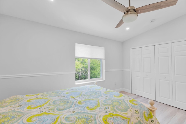 bedroom with light wood-type flooring, recessed lighting, a closet, a ceiling fan, and baseboards
