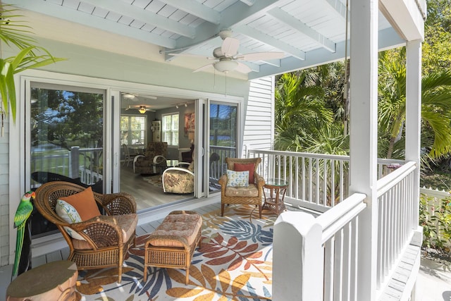 exterior space featuring beamed ceiling, wood ceiling, and ceiling fan