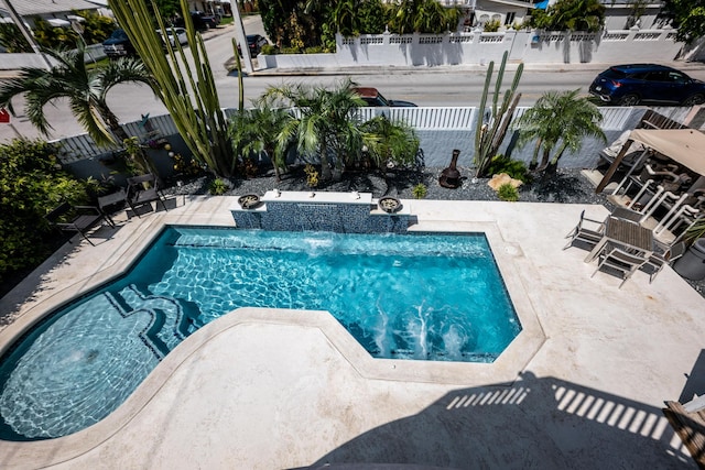 view of swimming pool featuring a patio area