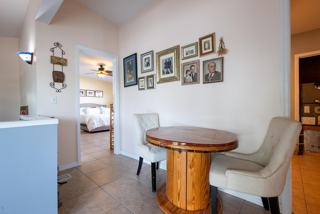 tiled dining room with ceiling fan