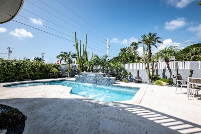 view of swimming pool featuring a patio and pool water feature