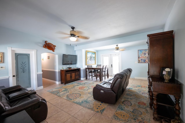 tiled living room featuring ceiling fan