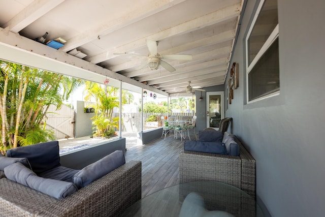 view of patio / terrace with ceiling fan and an outdoor living space