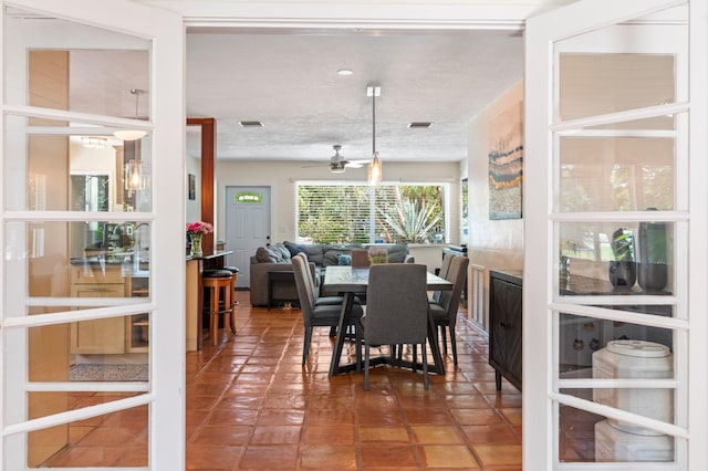 7563 Gulfstream Blvd, Marathon, FL 33050 - dining space with ceiling fan, a textured ceiling, and tile patterned flooring