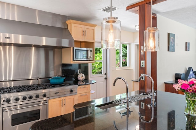 7563 Gulfstream Blvd, Marathon, FL 33050 - kitchen featuring light brown cabinetry, range hood, stainless steel appliances, tasteful backsplash, and a sink