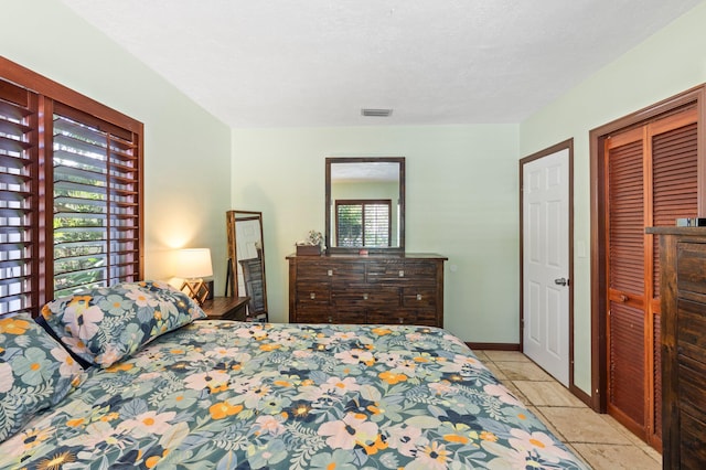 7563 Gulfstream Blvd, Marathon, FL 33050 - bedroom featuring tile patterned floors and a closet