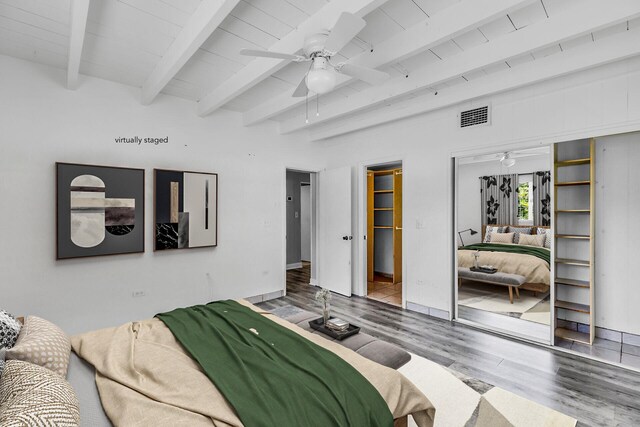 bedroom featuring beamed ceiling, wood-type flooring, and ceiling fan