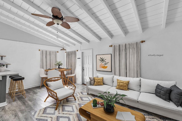 living room with vaulted ceiling with beams, wood ceiling, hardwood / wood-style floors, and ceiling fan