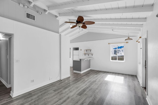 unfurnished living room with ceiling fan, wood-type flooring, lofted ceiling with beams, and wooden ceiling