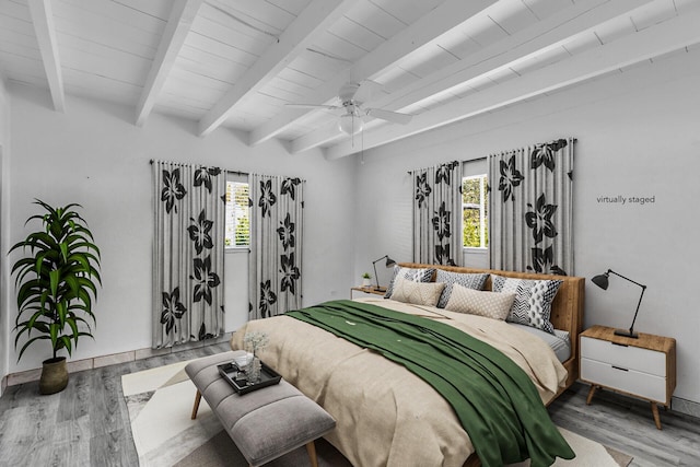 bedroom featuring wood-type flooring, ceiling fan, beam ceiling, and wood ceiling