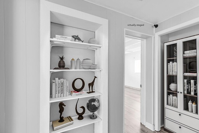 details featuring hardwood / wood-style flooring and ornamental molding