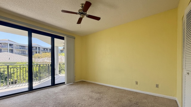 1800 Atlantic Blvd Unit C130, Key West, FL 33040 - unfurnished bedroom featuring access to exterior, carpet flooring, baseboards, and a textured ceiling