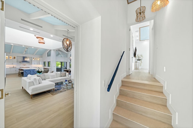 staircase with hardwood / wood-style flooring