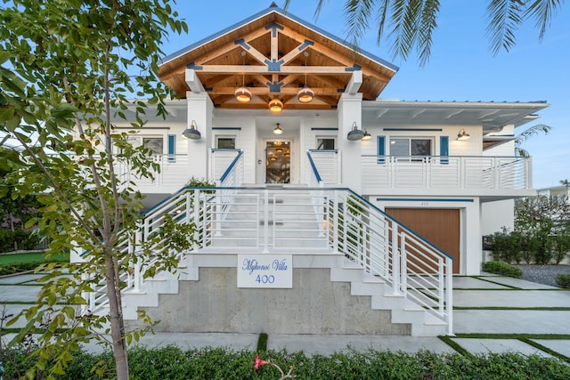 view of front of property featuring a porch and a garage