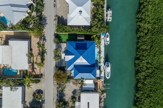 birds eye view of property featuring a water view