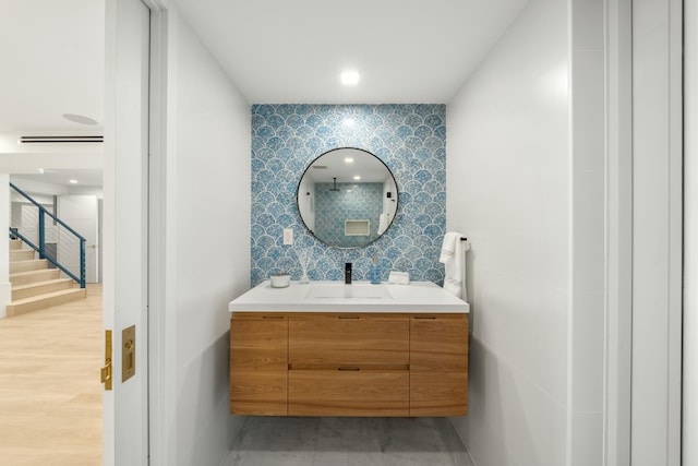 bathroom featuring hardwood / wood-style flooring and vanity