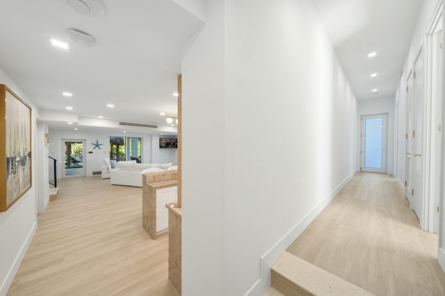 corridor featuring light hardwood / wood-style floors