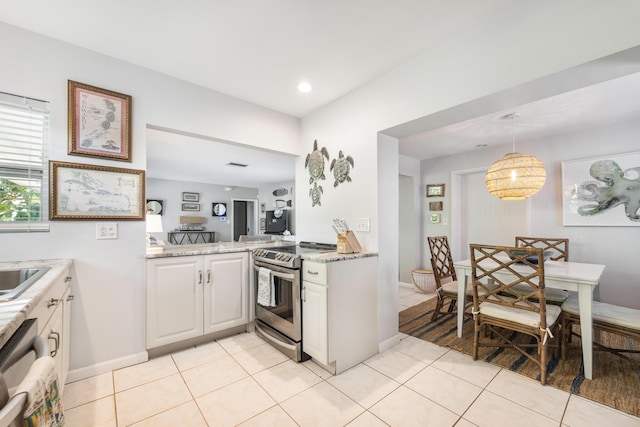 kitchen with white cabinetry, light tile patterned flooring, pendant lighting, and stainless steel range with electric cooktop