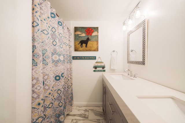 bathroom featuring walk in shower and vanity