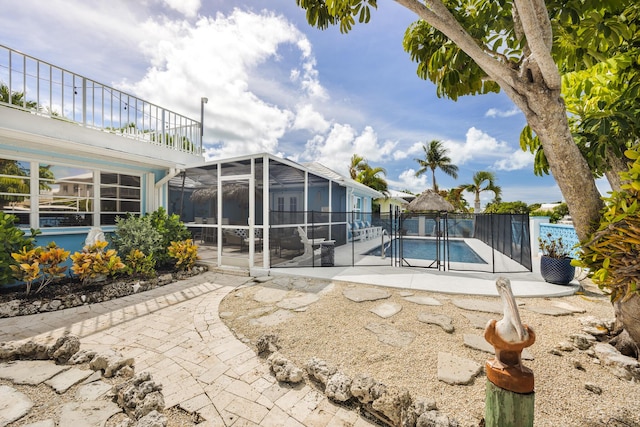 view of pool featuring a lanai and a patio