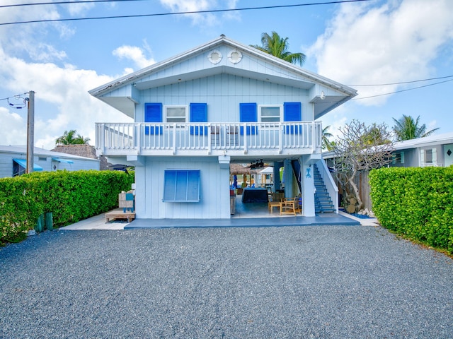 view of front of home featuring a balcony